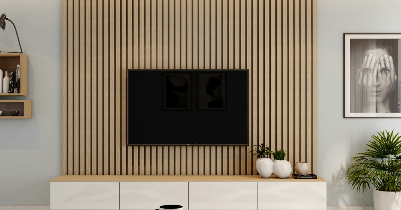 Light wood slat accent wall with a mounted TV and a floating white media console
