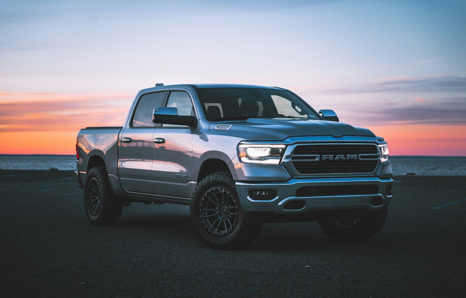 Silver pickup truck with tinted windows at sunset