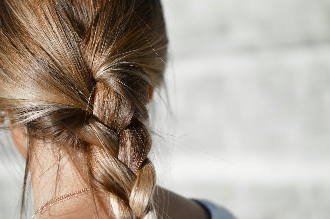 A long loose braid in brown blended hair